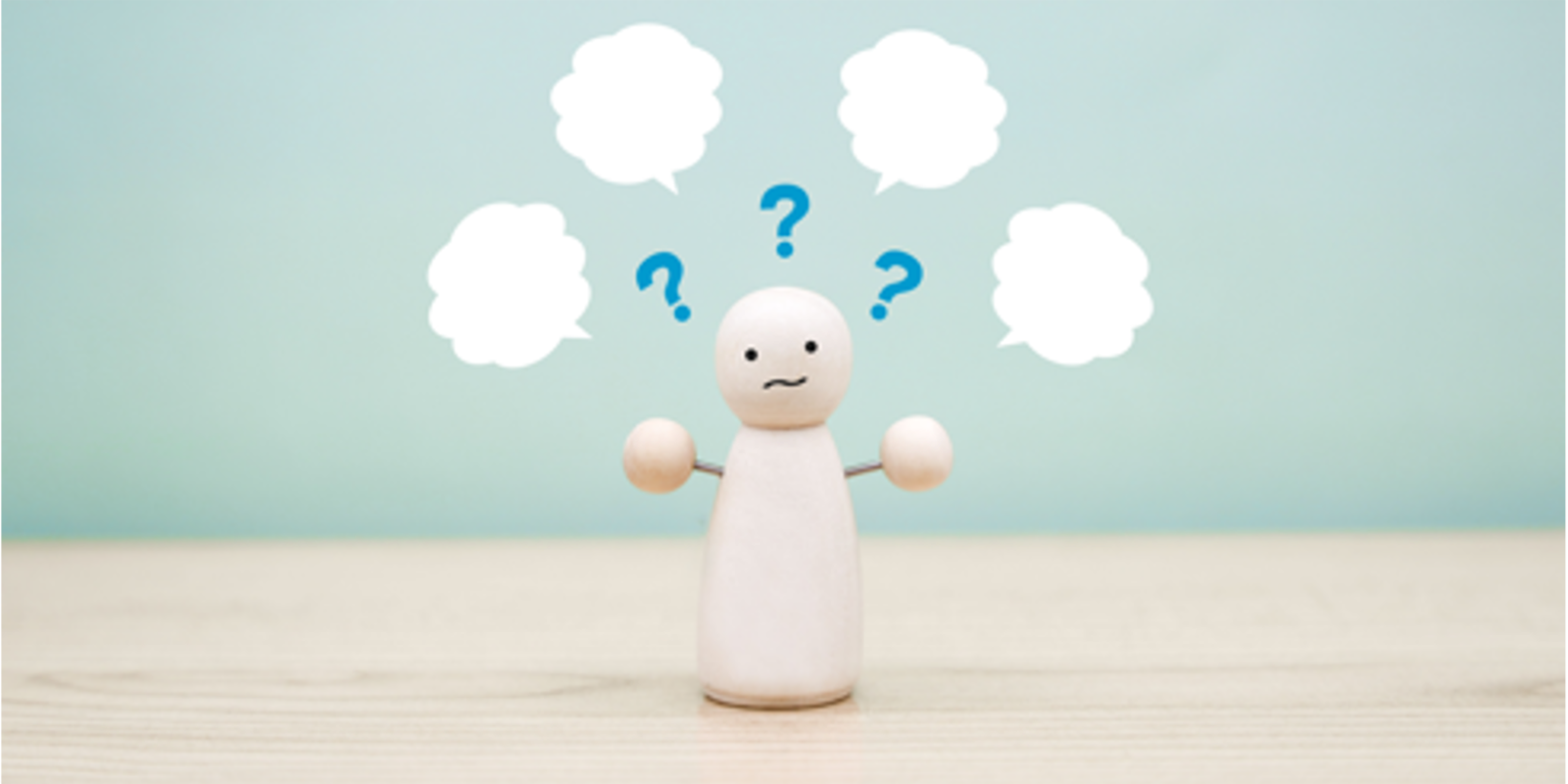 頭の上にはてなを出し、悩んでいる人形
